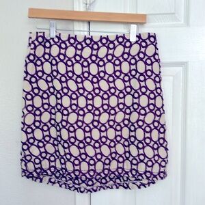 Mini skirt, purple and cream colored.